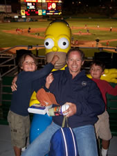 July 2010: Alex, Max and Poppa with Homer Simpson at the Isotopes park