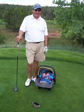 July 2010: Golfing with Daddy.