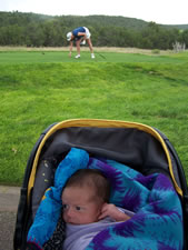 July 2010: Mama teeing off in the background