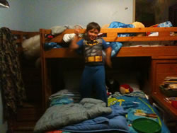 October 2011: Max in his Batman pj's. He was jumping off the top bunk for an hour!