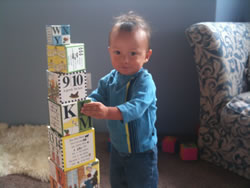 October 2011: Zeke loves building block towers these days