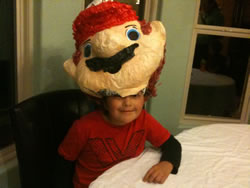 October 2011: Max with a large Mario pinata on his head