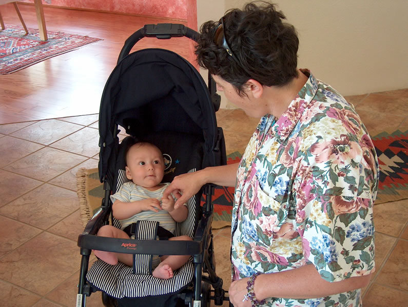 Alex with Leslie Staller in the stroller his Santa Fe friends gave him at the shower.