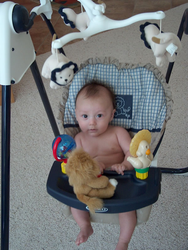 Alex in the lion swing his Santa Fe friends gave him.