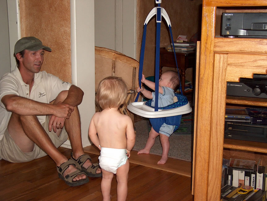 Kirk and Hunter Rawles with Alex in bouncy swing.