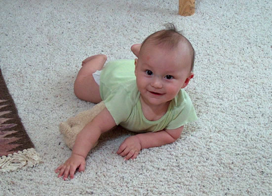 Tummy time, trying to crawl.