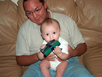 Alex open a gift from Aunt Catherine. (91kb)