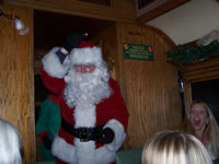 November 2007: Santa boards the train at the North Pole and gifts each child a sleigh bell. You have to hand it to the Durango and Silverton Narrow Guage Railroad for putting this together. It was very nice.