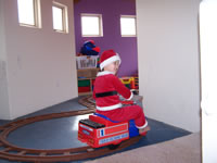 November 2007: Alex Santa on the choo-choo in the play room