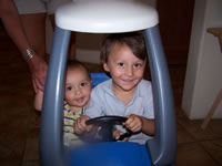 Max and Alex in the cozy coupe