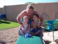 Alex and Ashlyn at the pool with Chris DeMeritt